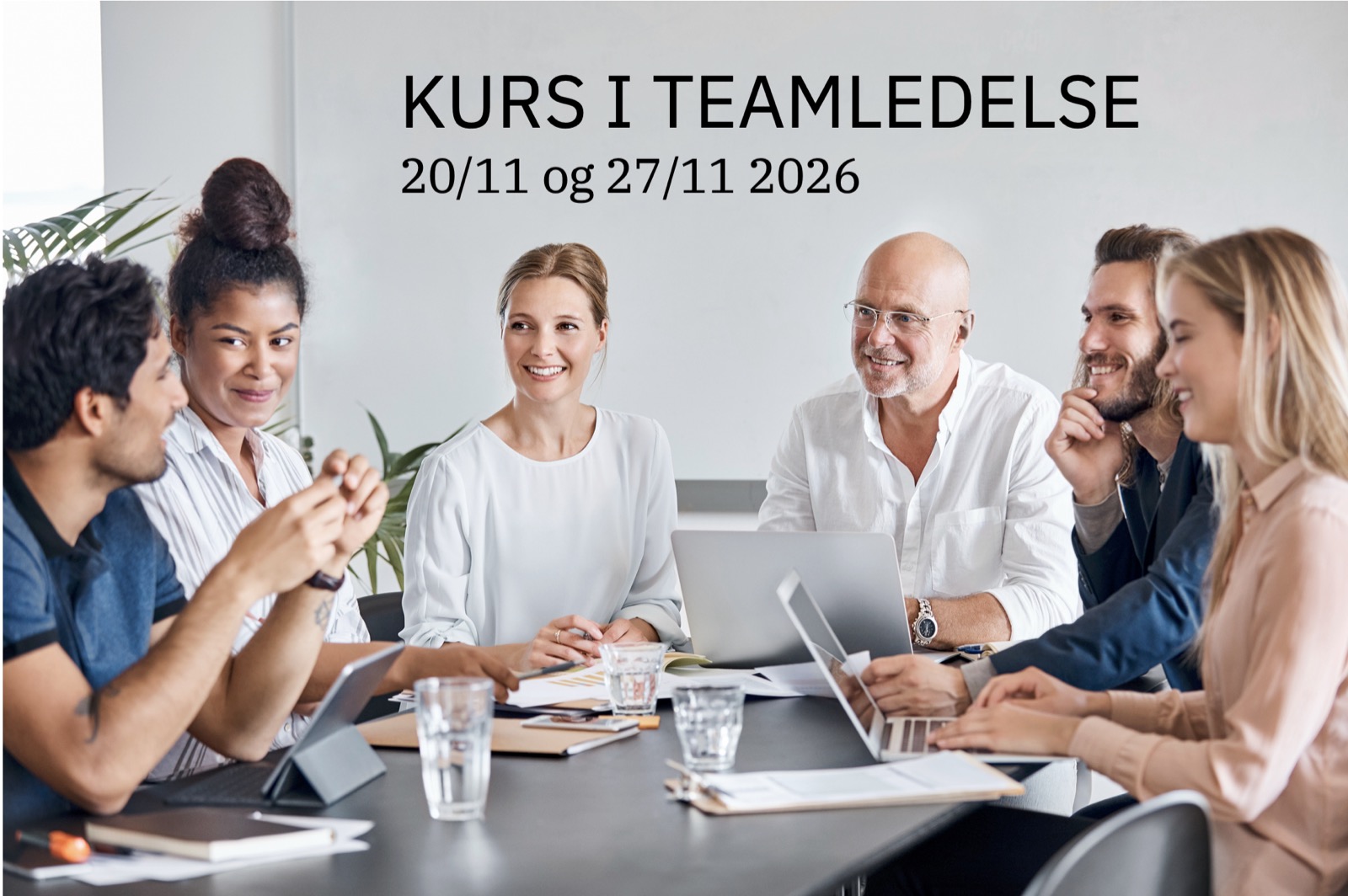 Teamledelse med engasjerte kolleger rundt et møtebord